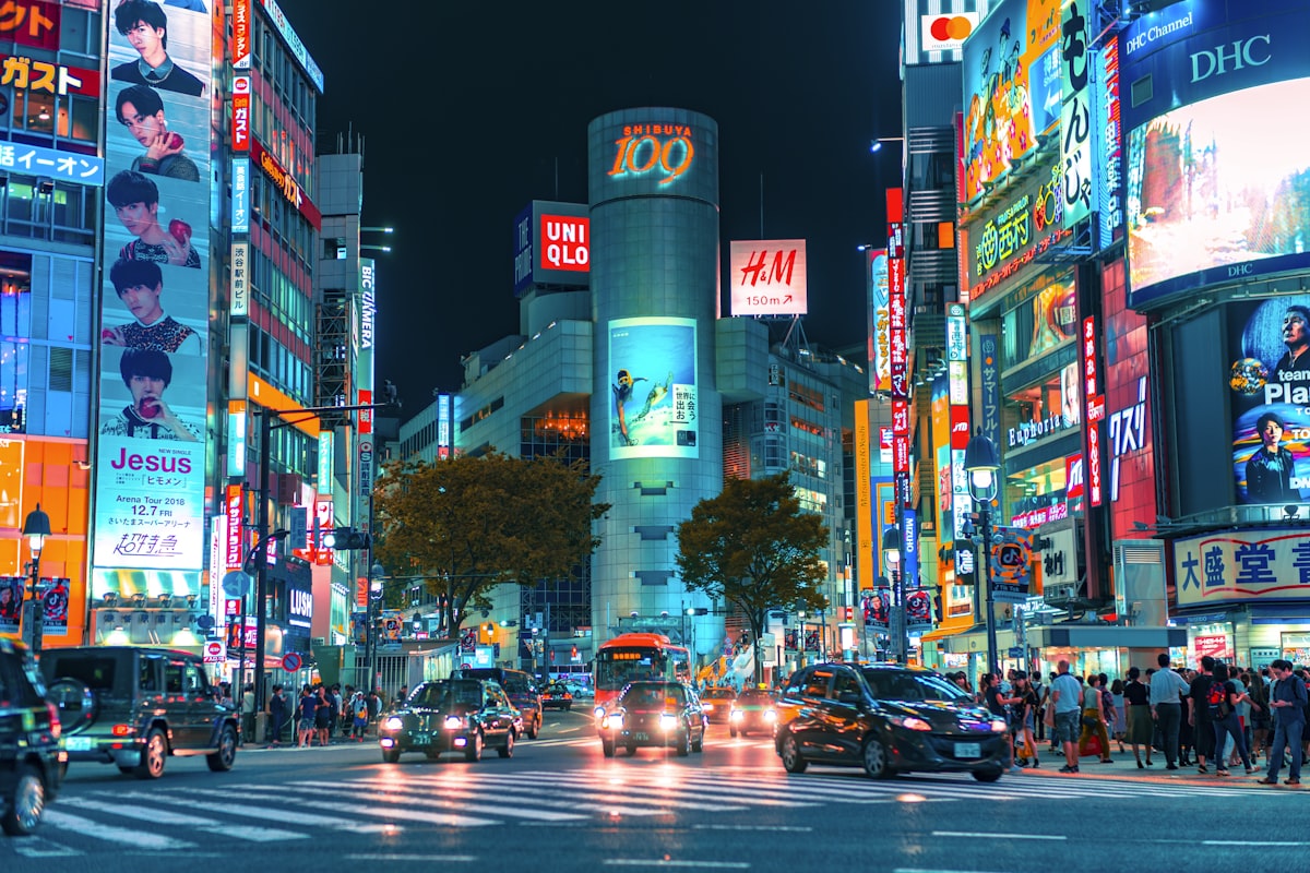 Tokyo at night — neon lights reflecting on wet streets